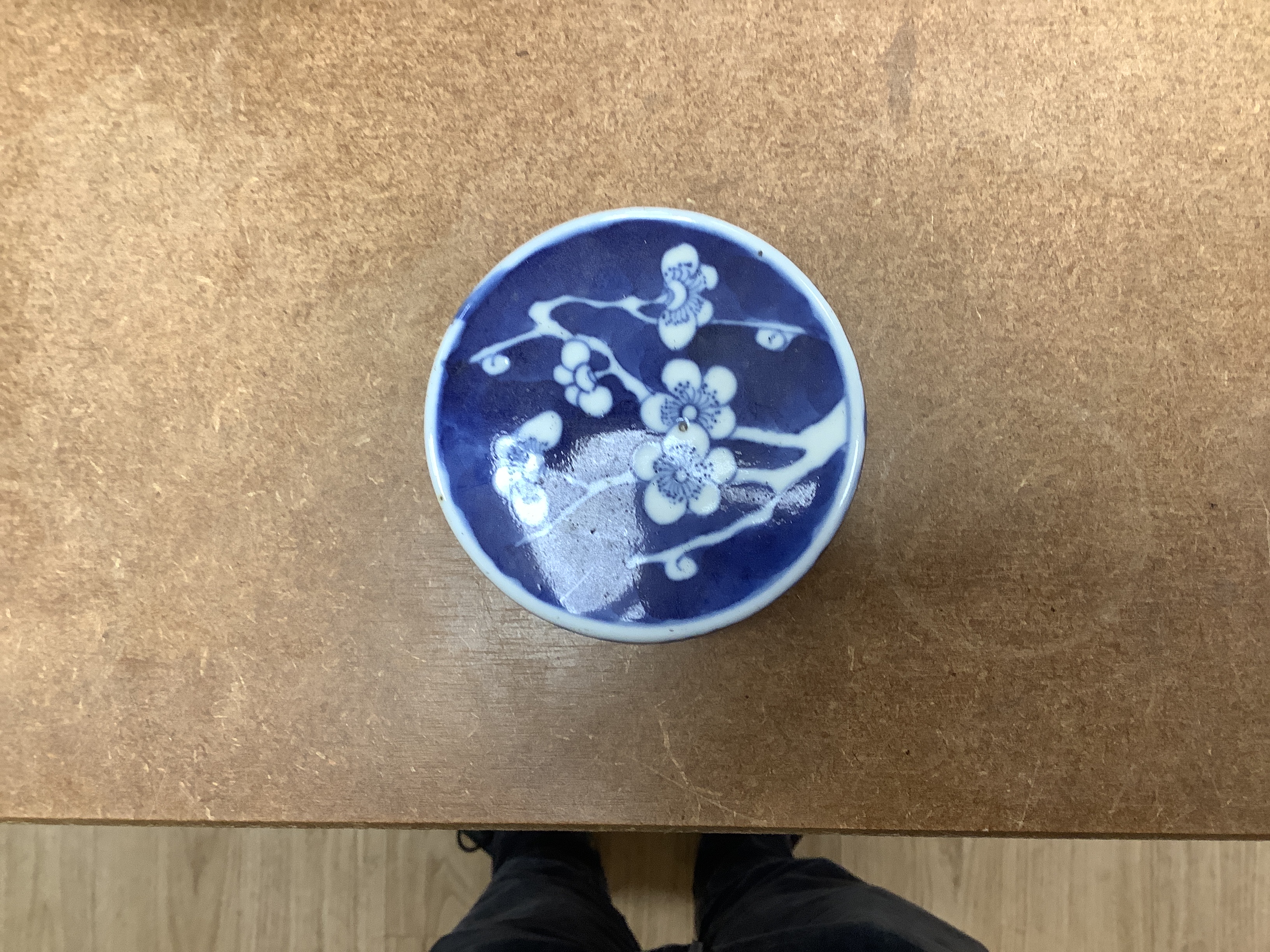 A 19th century Chinese blue and white prunus jar and cover, together with two similar tiles, jar 21cm